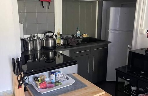 Excideuil Apartment | Studio king size bed, kitchen, living/dining room.