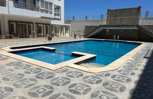 Village Road Apartment | Studio with a pool view
