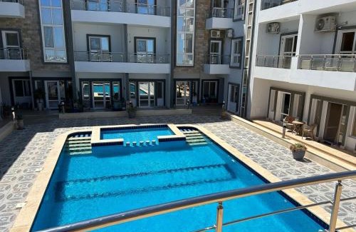 Village Road Apartment | Studio with a pool view