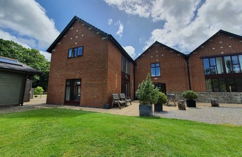 Woolland House | Stunning Barn Conversion with Exclusive Bar, Pool, Hot Tub & Countryside Charm