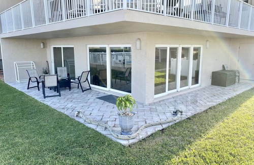 New Smyrna Beach Condo | STUNNING ground floor condo, direct OCEAN front, steps to community pool!