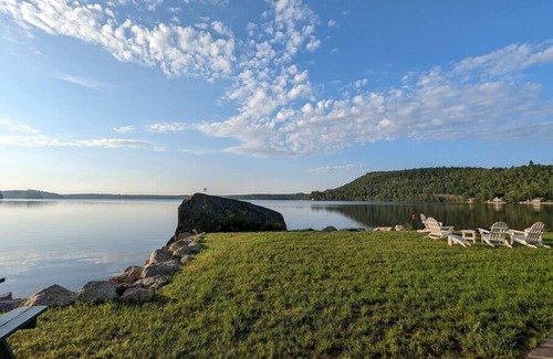 Dedham Cottage | Stunning lakefront home with 270° water views and private beach near Acadia