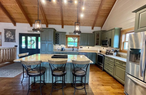 Chalet Village North Cabin | STUNNING MOUNTAIN VIEWS! Multiple HUGE Decks, Game Room, Fire Table, Hot Tub!