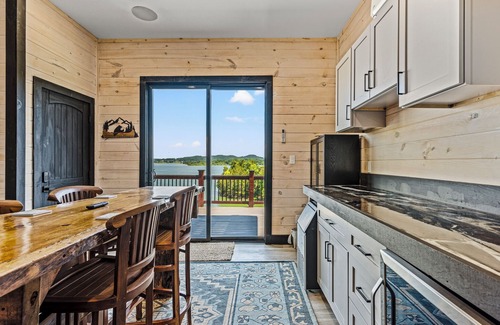 Sevierville Cabin | Stunning Mtn Cabin on Lake w/2 Stry Dock, Indoor Pool, Hot Tub, and Arcade Room