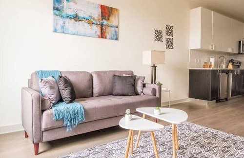Downtown Louisville Apartment | Stunning Nulu 1BR CozySuites 02