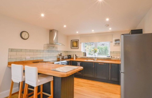 Oban House | Stunning private villa for 6 guests with hot tub, WIFI, TV, patio and pets allowed