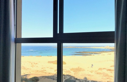 Los Lagos Apartment | Stunning views & location. Spacious 1 bed apartment directly on beach El Cotillo