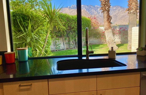 Palm Springs Condo | Stylish and sun filled condo with mountain views, private patio and lush grounds