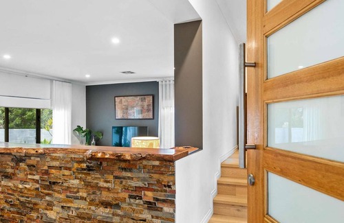 City Beach House | Stylish family and pet friendly 4 BR home with pool close to beach