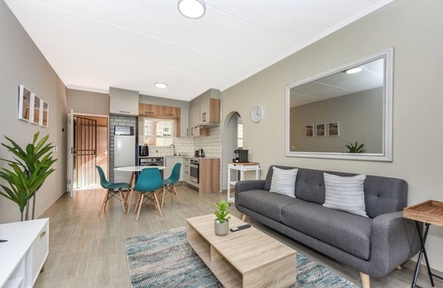 Sandown Apartment | Stylish Garden Retreat w/Pool and Modern Amenities