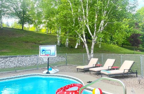Johnsburg Ski Chalet | Stylish Mountain View Chalet with Heated Pool, Large Hot Tub, Playroom & Firepit close to Gore Mountain