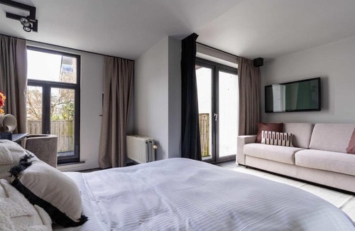 South Antwerp Apartment | Stylish suite with private patio, perfect for 4