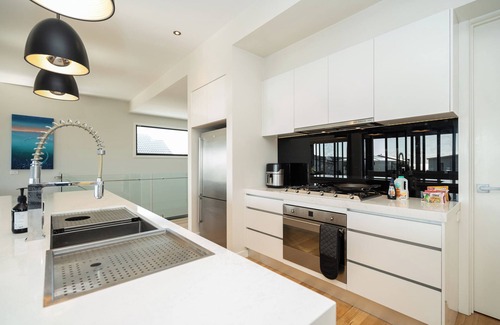 Curlewis House | Summer-Ready Retreat: Sparkling Bay Views, Heated Pool, Fire Pit & Games