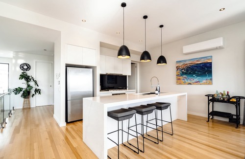 Curlewis House | Summer-Ready Retreat: Sparkling Bay Views, Heated Pool, Fire Pit & Games
