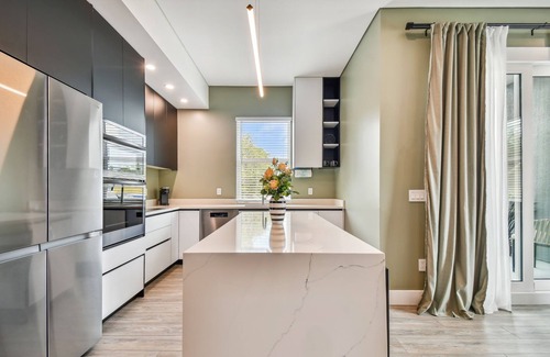 Historic Old Northeast Apartment | Sun Soaked Designer Condo with Patio