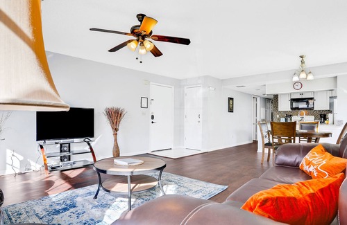 Royal Palm Bay Condo | Sunflower-yellow condo with pool, W/D, hot tub & kitchen - dog/snowbird-friendly