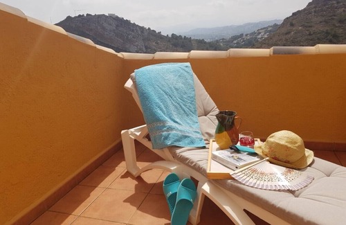 Cumbre del Sol Apartment | Sunny apartment on the Cumbre Del Sol with views of the mountains, air conditioning, wifi