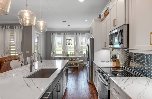 Villa Lago House | Sunny getaway with 2 golf carts, patio, grill, pool, & tennis