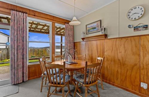 Hilltop House | Sunny Hilltop Red Bach w Lake and Mountain Views