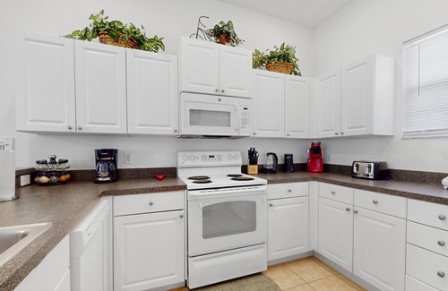 Tuscan Hills House | Sunny home with pool, lanai, foosball, fast WiFi & washer/dryer