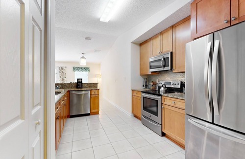 Palm Coast House | Sunny home with private heated pool, pool spa, fireplace, patio, grill, W/D, AC