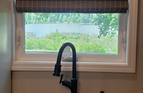 Six Lakes Cottage | Sunset Cottage: Lakefront Escape - Fenced Yard - Pet Friendly - Kayaks - Fishing