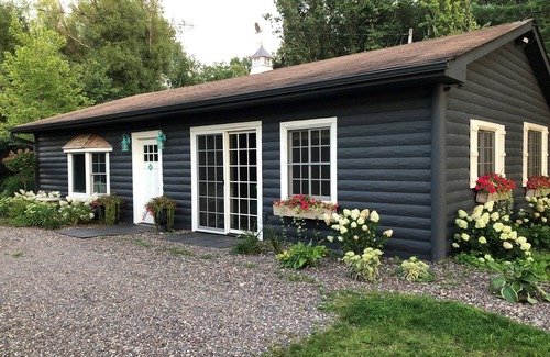 Amery Cabin | Sunset Cottage on Lake Wapogasset, Amery WI with Bunk Room, Hot Tub, AC, & more