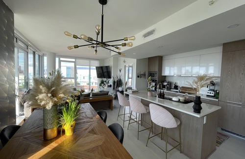 Mount Pleasant Condo | Sunset view 2 bed, 2 bath condo in heart of Mount Pleasant w/gym + deck