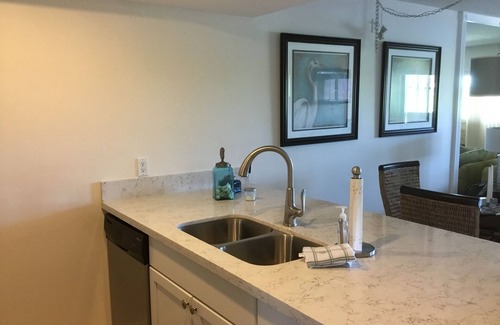 Stuart Condo | Sunshine & Palm Trees Overlooking The Water- Walk To The Beach!