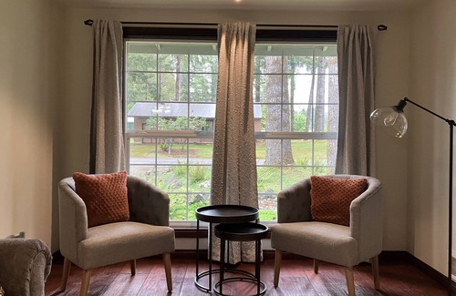 Forks House | Surrounded by trees, this 3-bedroom, fully stocked retreat sleeps 8.