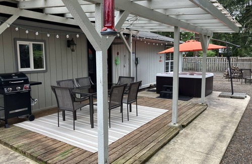 Forks House | Surrounded by trees, this 3-bedroom, fully stocked retreat sleeps 8.