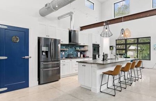 Butler Beach House | Swim & Dock in Style: Art Deco Beach Escape