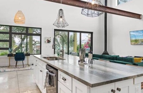 Butler Beach House | Swim & Dock in Style: Art Deco Beach Escape