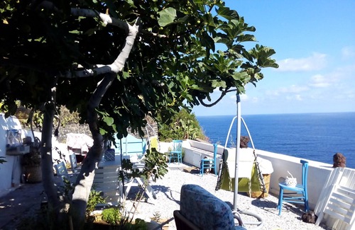 Malfa House | Terrace and garden overlooking Stromboli and Panarea,