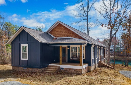 Mentone House | The Away Place-hot tub & fireplace on the lake