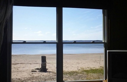 Shell Lake Cabin | The beach is calling.right outside your window. come relax and play!