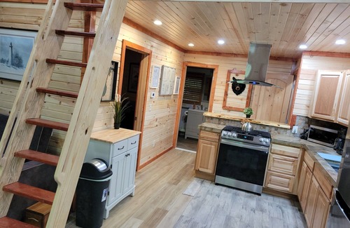 Thompsonville House | The "Bear Den" 500' Betsie river waterfront Guest home.