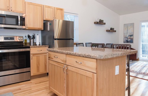 Egg Harbor Cottage | The best patio and firepit at The Cat's Lair in the woods! Level 2 EV charger!