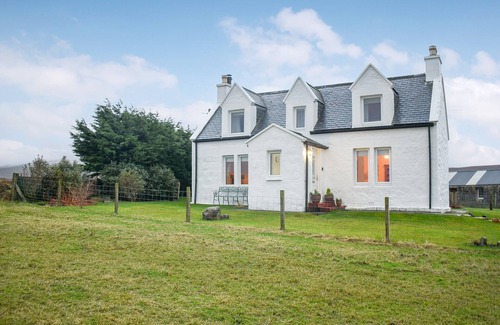 Staffin Cottage | The cottage is in a fabulous location and enjoys a cosy wood burner - perfect in the evenings.