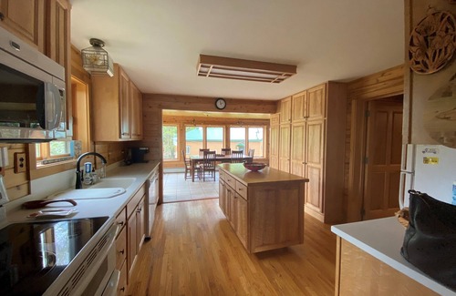 Big Bay House | "The Dam House" Lake and River Front Home with Beautiful Sunset Views