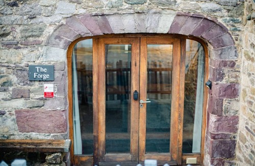 Tenby House | The Forge · St Davids Hideaway with Roll-top Bath & Log Burner
