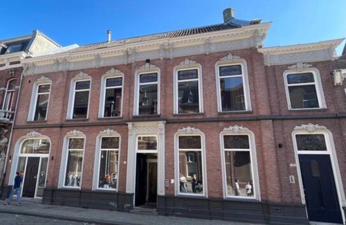 Centrum Apartment | The ground floor studio, spanning 30m2, offers a cozy retreat with a stylish wood herringbone floor