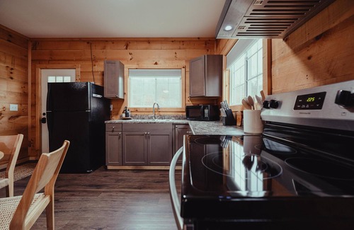 South Bloomingville Cabin | The Hideout - Escape to The Hideout in Hocking Hills, OH! This cozy, pet-friendly cabin offers a private deck by Pine Creek, just minutes from hiking, waterfalls, and caves. Perfect for up to 4 guests. Book your nature-filled getaway today!