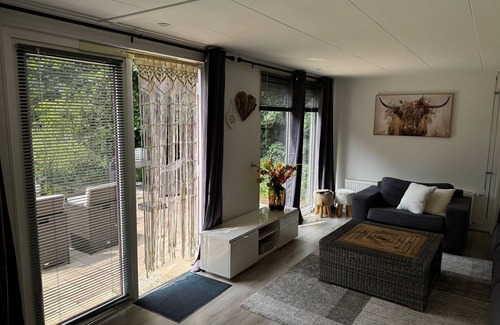 Egmond aan den Hoef House | The Hoeve'r Duinzicht vacation apartment is completely at ground level, has three comfortable bedrooms and a sheltered, green garden on the west side. Enjoy peace, space and privacy - with the beach and the cozy center in Fa