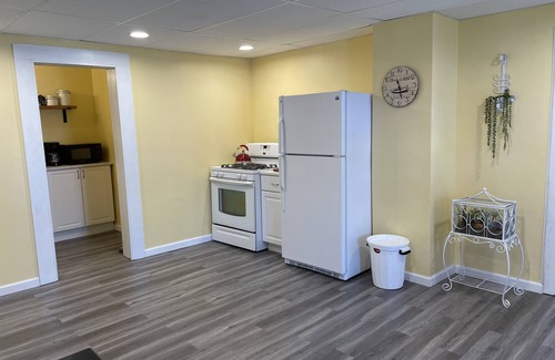 Winchester Apartment | The Inn at Highland Lake, 1st Floor, waterfront yard with a boat dock