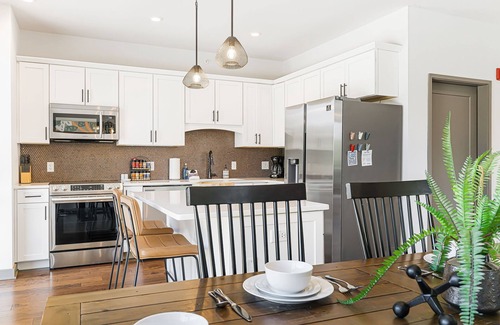 Historic Montford Condo | The Kingfisher - Fantastic 2-bedroom condo with mural, elevator, and WFH setup