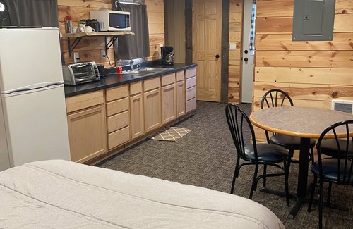 Luverne Cabin | The Little Red Barn - Lakeside Tiny Home Rental -Sleeps 4 - Spiral Staircase