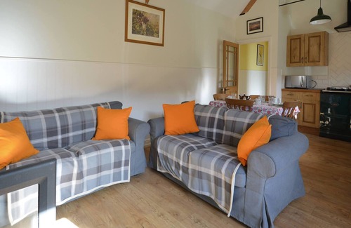 Nunney House | The Old Parlour - timber clad cosy converted cow shed
