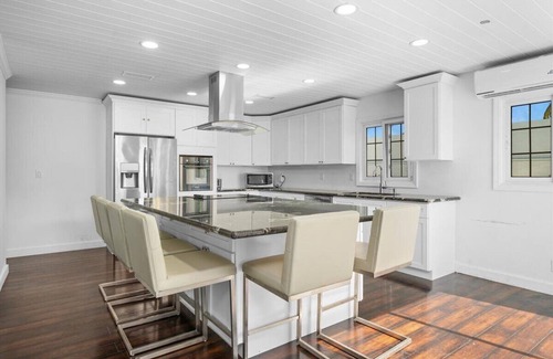 Bahama Palm Shores House | The Paradise. Beachfront property with a pool; accommodates 14 guests.