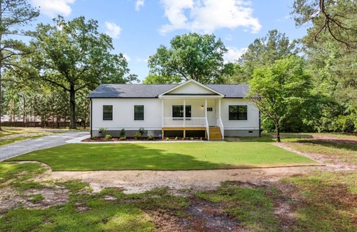 Carthage House | The Porch and Pines Cottage